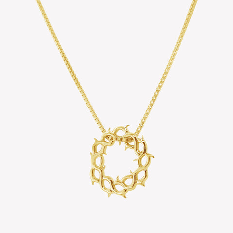 Crown of thorns necklace in gold vermeil by Rizen Jewelry.  Box chain is threaded through faith inspired crown of thorns pendant. 